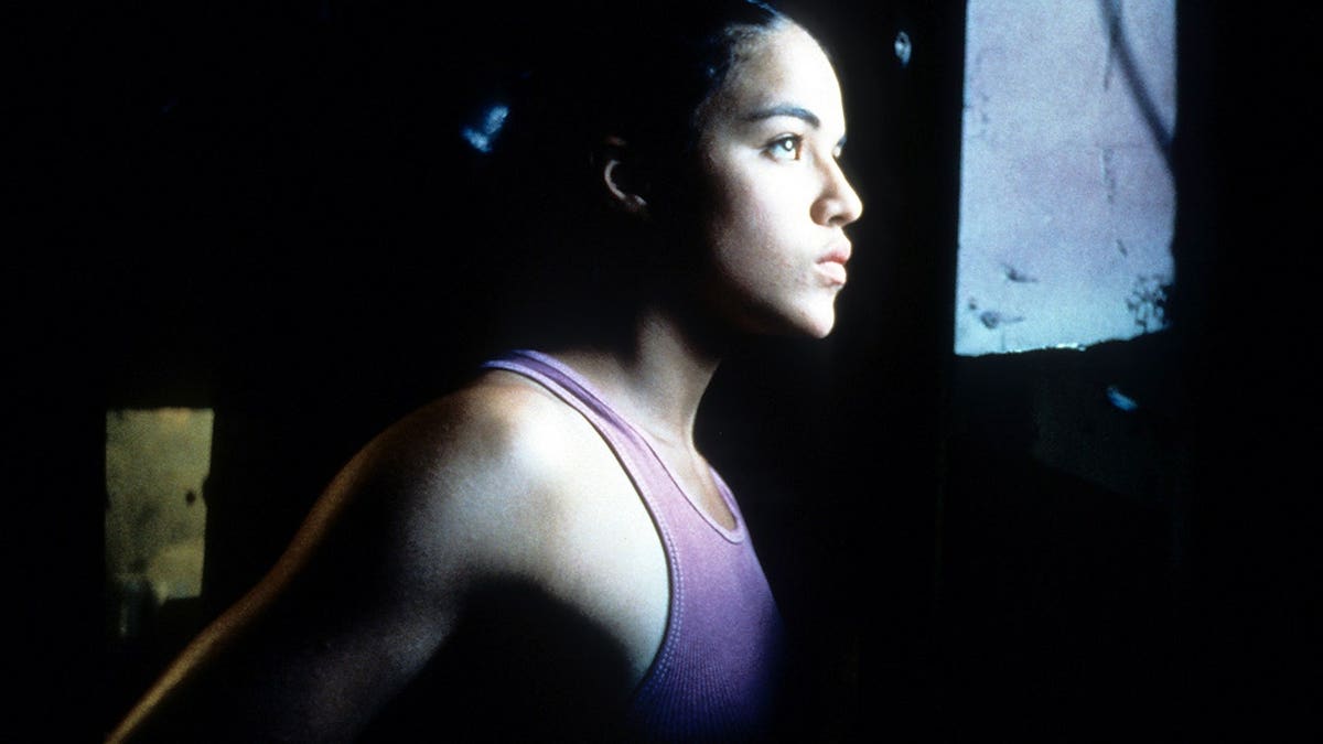 Michelle Rodriguez looks out a window in a scene from the film Girlfight.