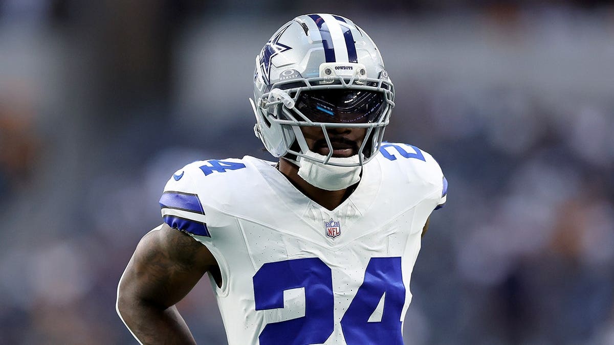 Miles Sanders, Dallas Cowboys running back, looks on before a game at AT&T Stadium.