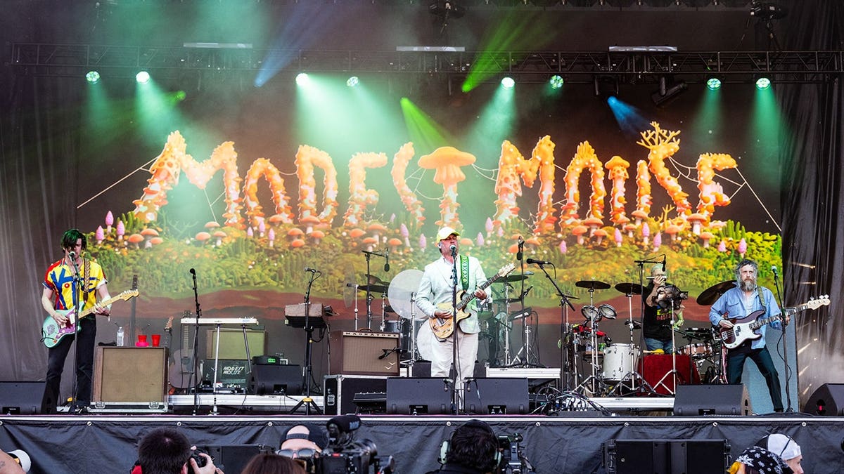 Modest Mouse performs on stage
