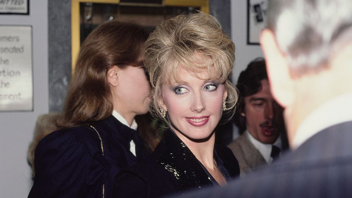 Morgan Fairchild stands at an event in the United States, circa 1980s.