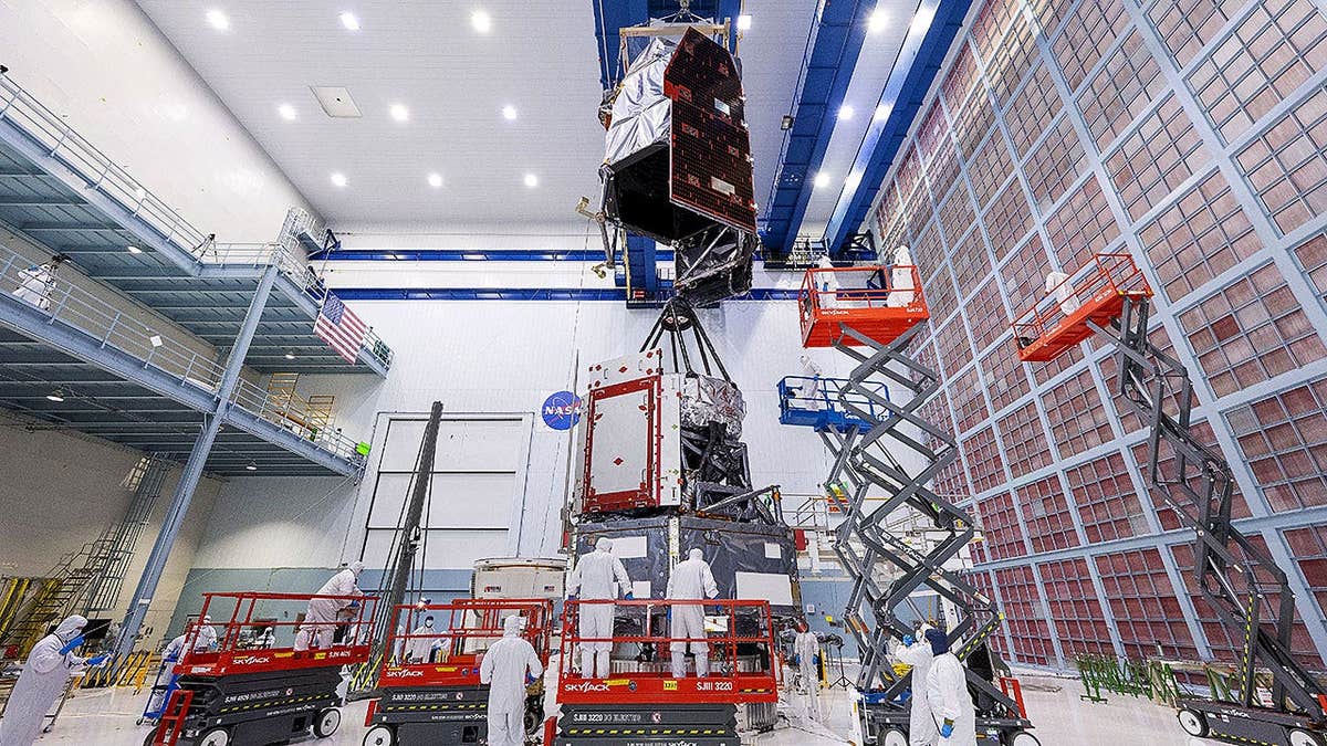 Technicians connect inner and outer segments of NASA's Nancy Grace Roman Space Telescope.