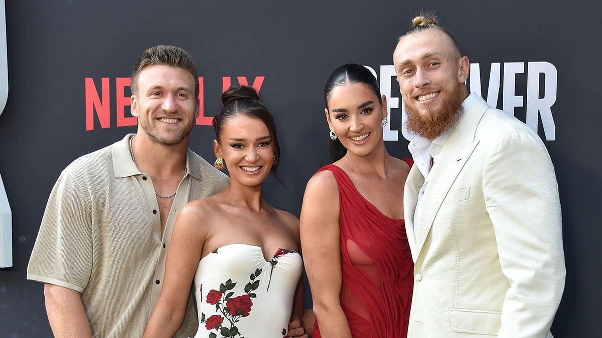 Kyle Juszczyk, Kristin Juszczyk, Claire Kittle and George Kittle pose together at a premiere event.