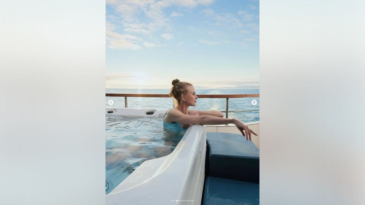 Nicole Kidman in a hot tub looking out onto the ocean while on a yacht.
