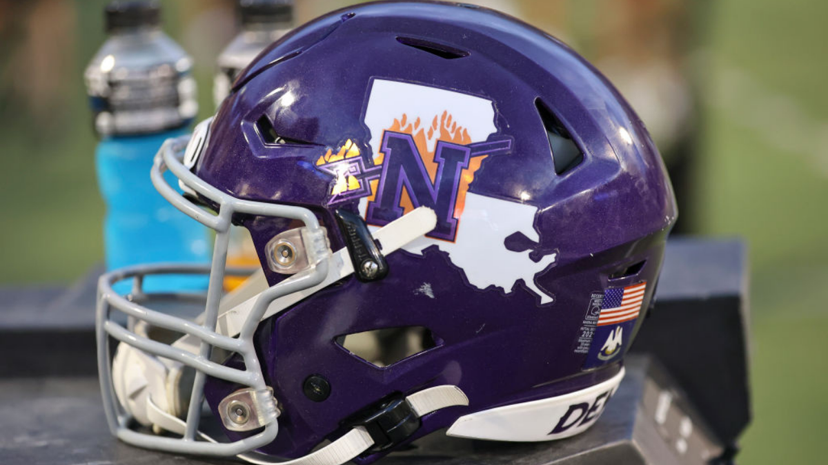 Northwestern State helmet rests on the bench during a college football game.