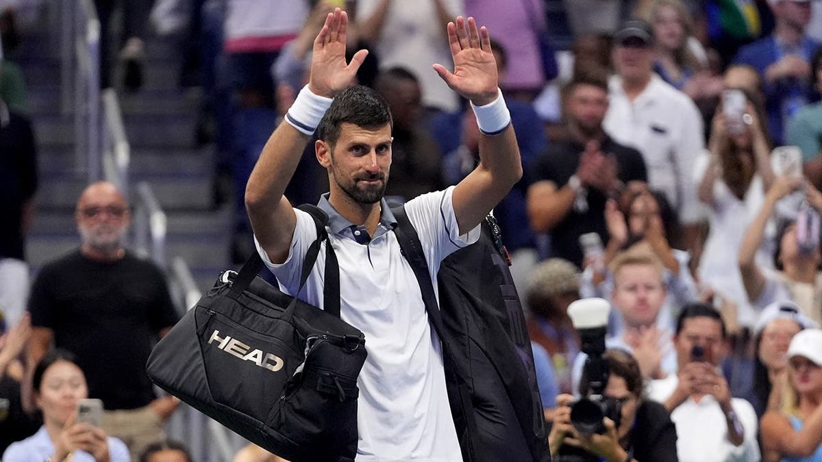 Novak Djokovic gestures to the crowd after losing to Mariano Navone at the U.S. Open.