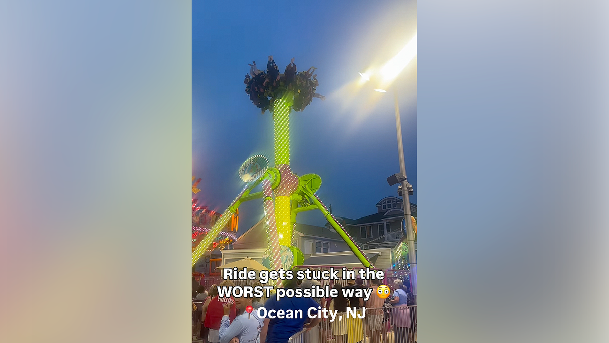 Riders are left suspended upside down after the Wipe Out ride malfunctioned at the Ocean City, New Jersey, boardwalk