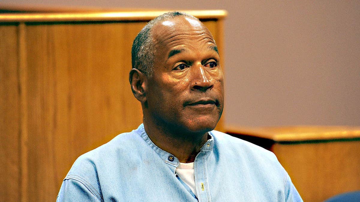 OJ Simpson stands in a scene.