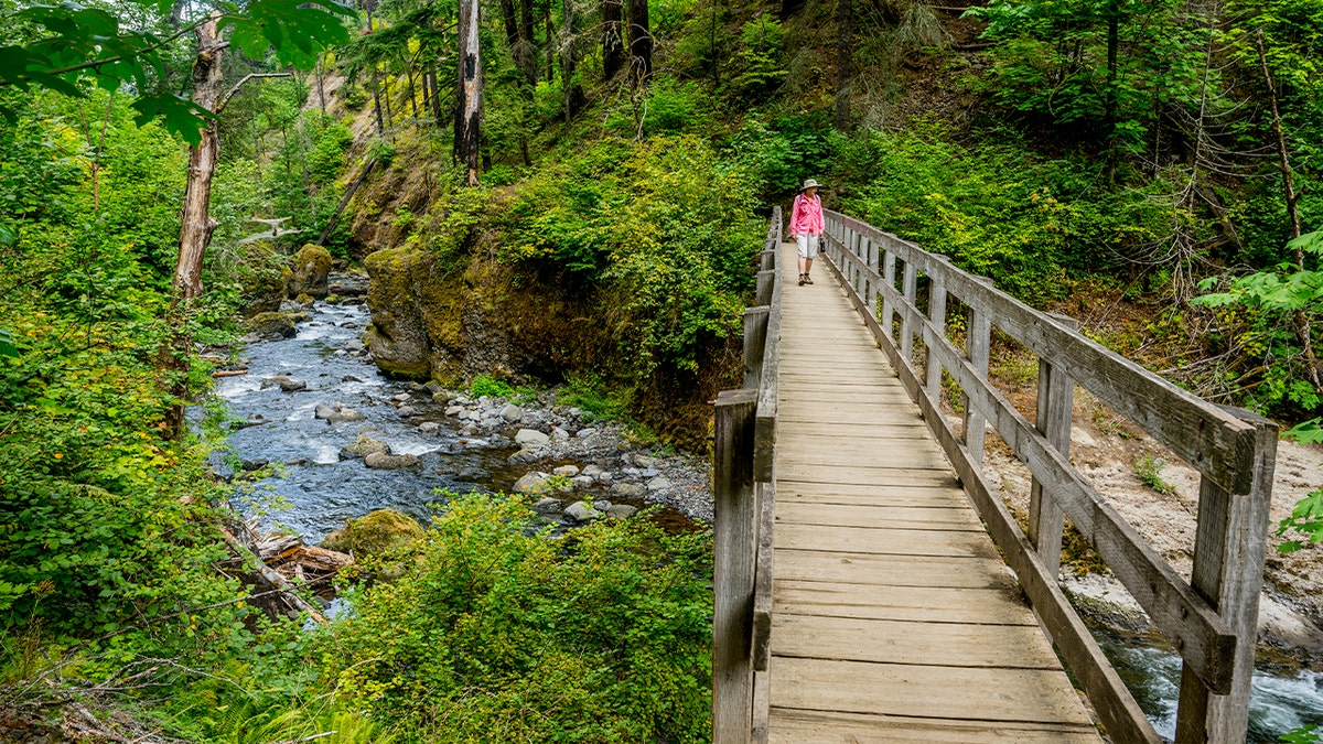 hiker on bridge