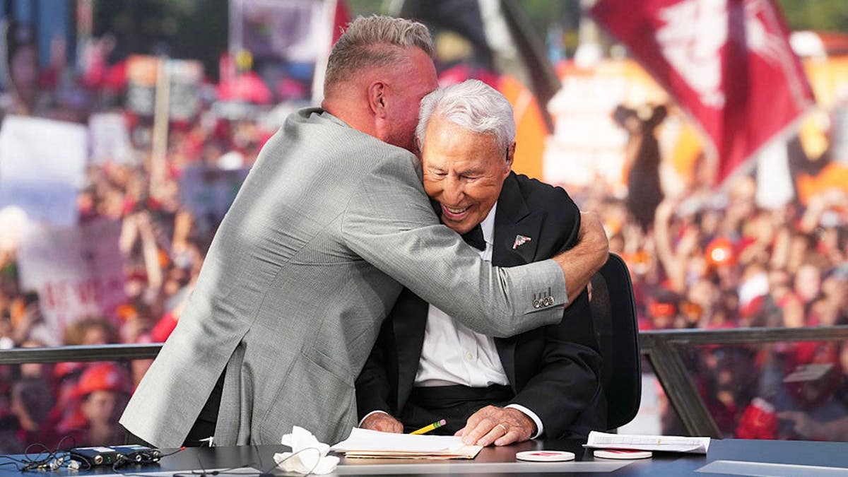 Pat McAfee hugs Lee Corso at Ohio Stadium.