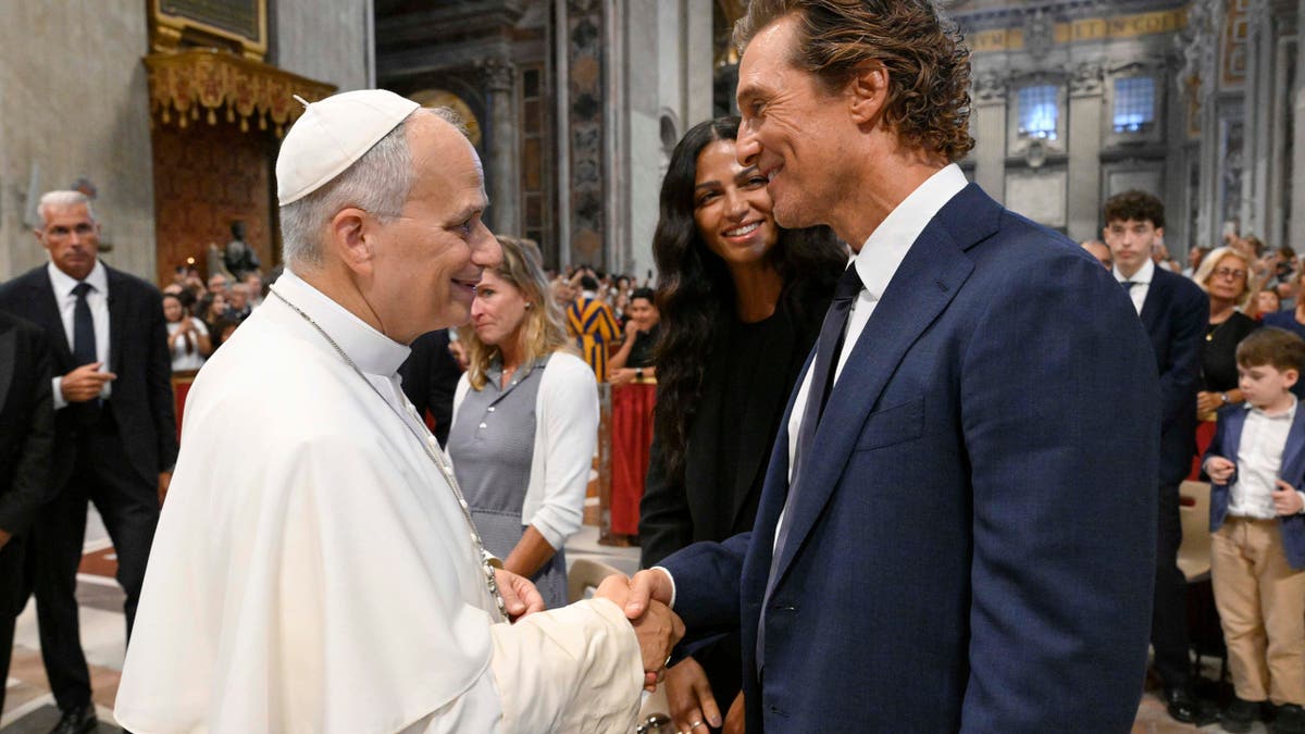 Pope Leo XIV greets Matthew McConaughey and Camila Alves at St. Peter's Basilica.