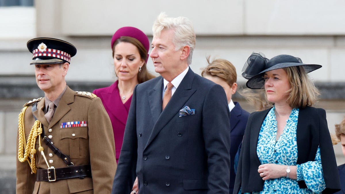 Prince Edward, Sir Clive Alderton and Sophie Densham depart Buckingham Palace.