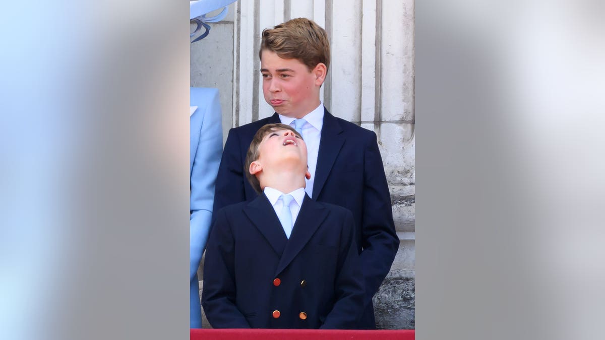 Prince George and Prince Louis of Wales stand during Trooping the Colour in London.