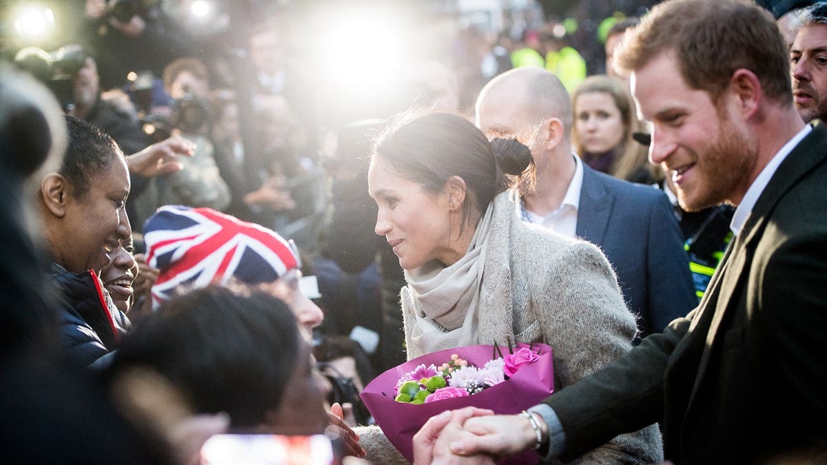 Prince Harry and Meghan Markle meet well-wishers at Reprezent 107.3FM in London.