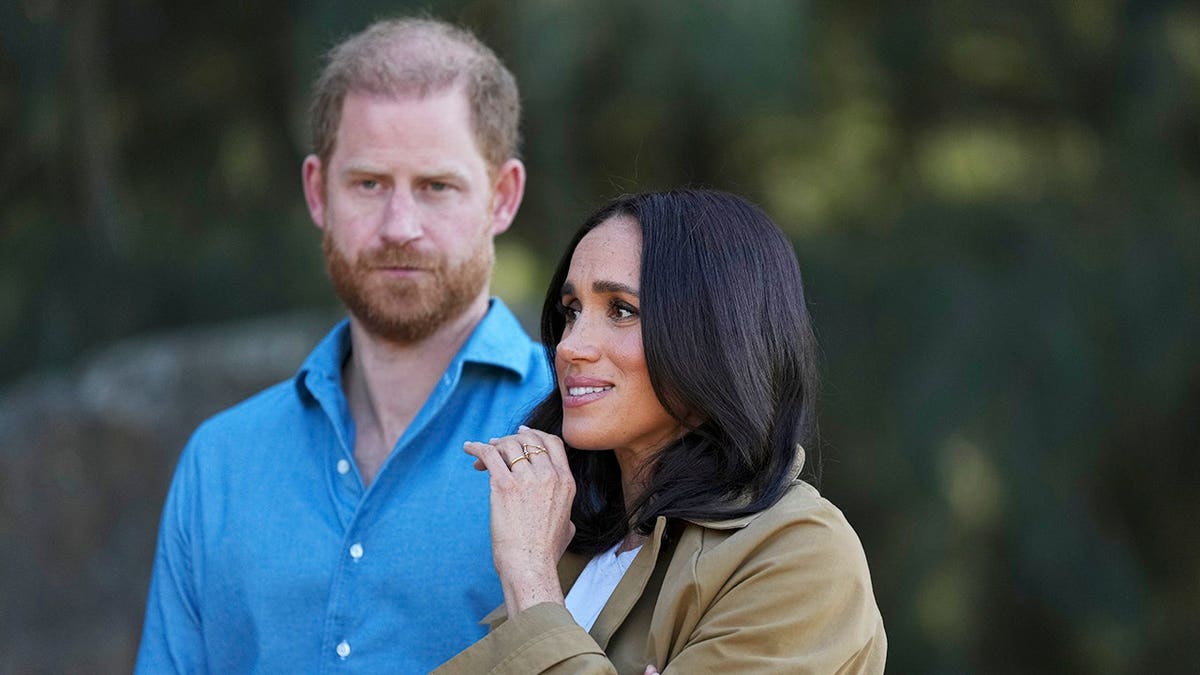Prince Harry and Meghan, Duchess of Sussex, walk during a Scar Tree Walk in Melbourne.