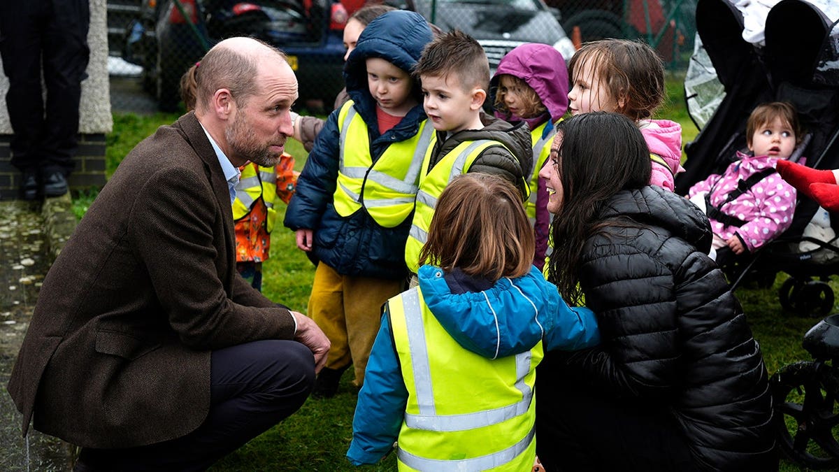 Prince William greets members of the public at Helston Community Fire Station in England.