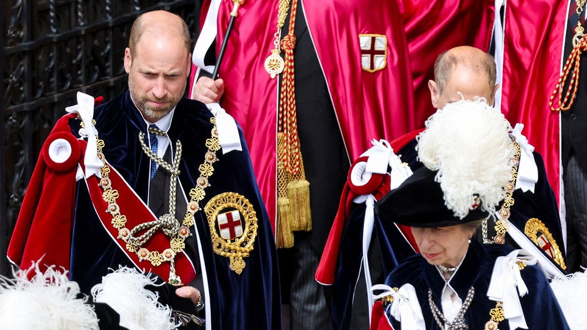 Prince William and Princess Anne leave St. George's Chapel during the Order of the Garter Service.