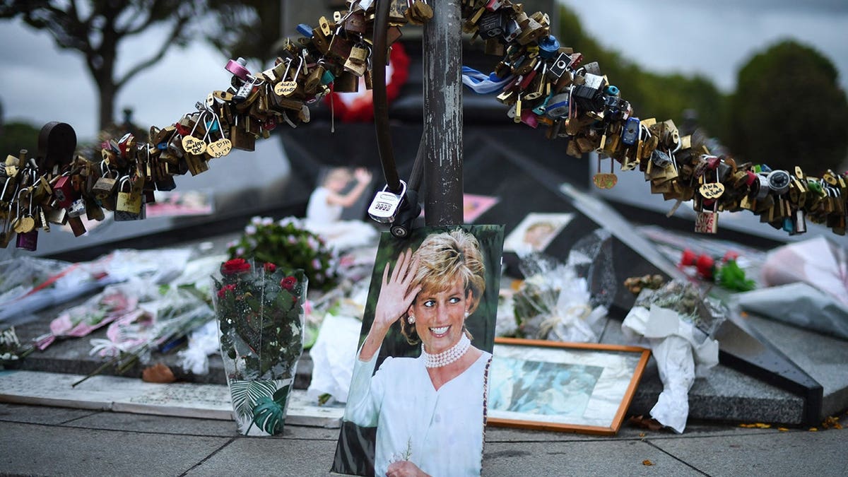 Photographs of Diana, Princess of Wales, displayed with locks and flowers on the Alma bridge in Paris.