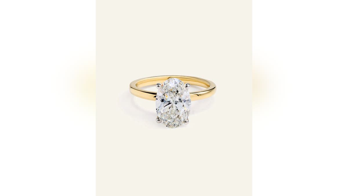 An oval diamond gives this ring a timeless look.