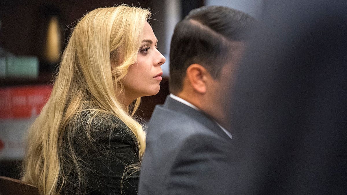 Rachel Buffett sits in superior court with her attorney David Medina during opening statements in Santa Ana.