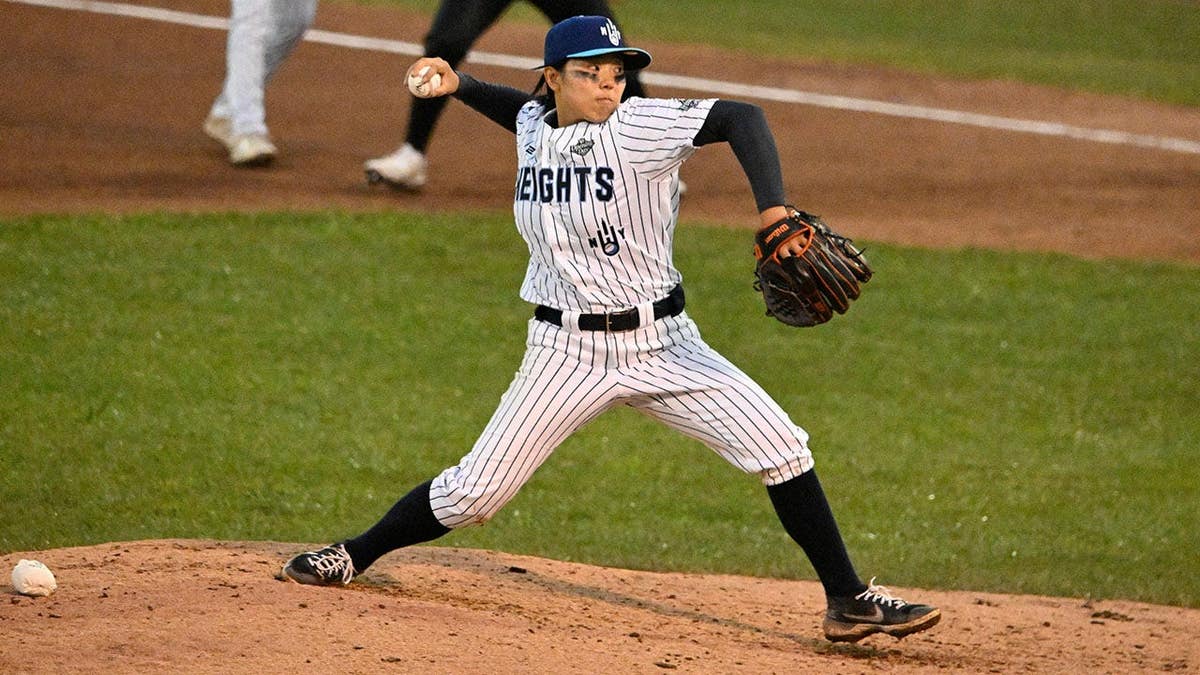 Rakyung Kim pitches during the fourth inning of a Women's Professional Baseball League game.