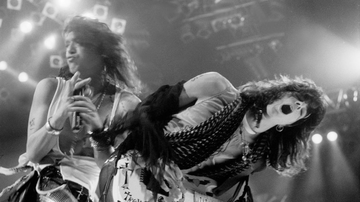 Stephen Pearcy and Warren DeMartini of RATT perform on stage at the Rosemont Horizon.