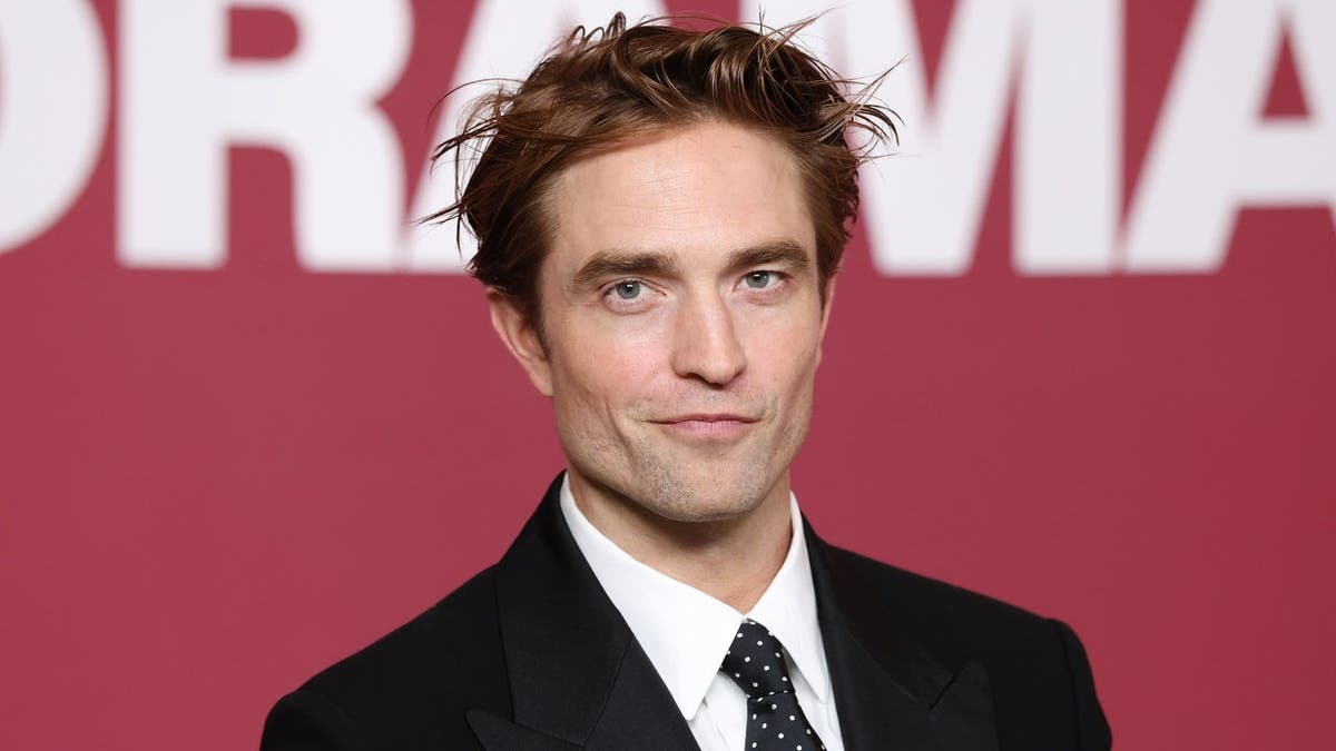 Robert Pattinson attends a premiere 