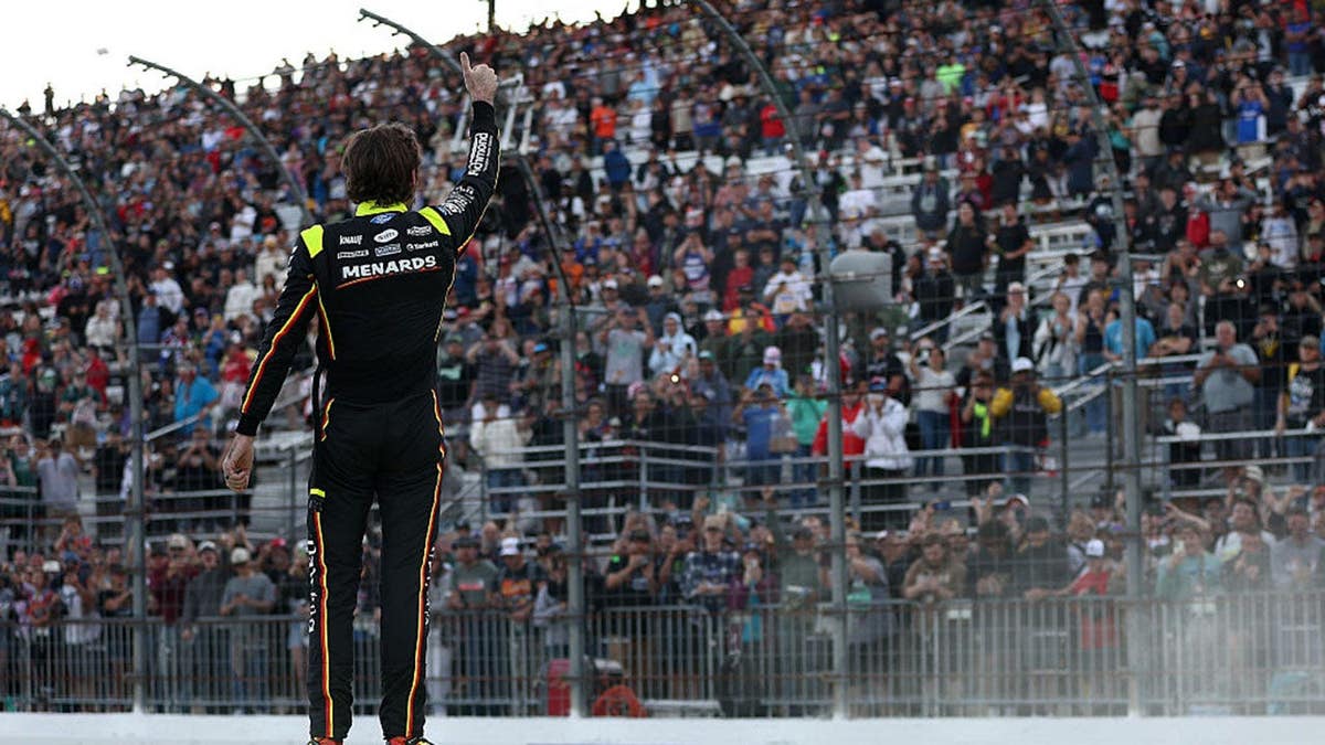 Ryan Blaney gives a thumbs up to fans after winning at New Hampshire Motor Speedway.