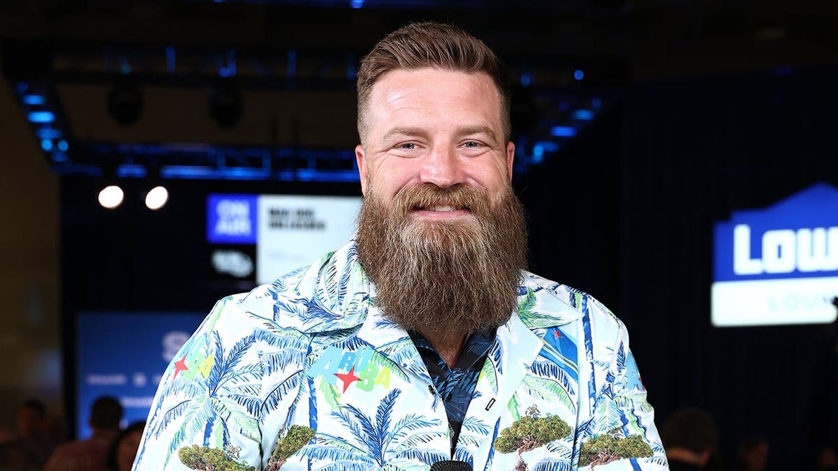 Ryan Fitzpatrick stands on Radio Row at Super Bowl LX in San Francisco.