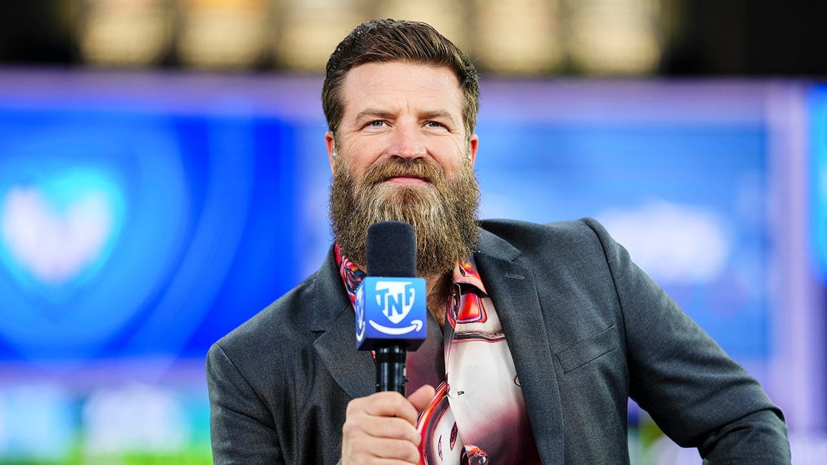 Ryan Fitzpatrick looks on from the TNF on Prime broadcast set at Gillette Stadium.