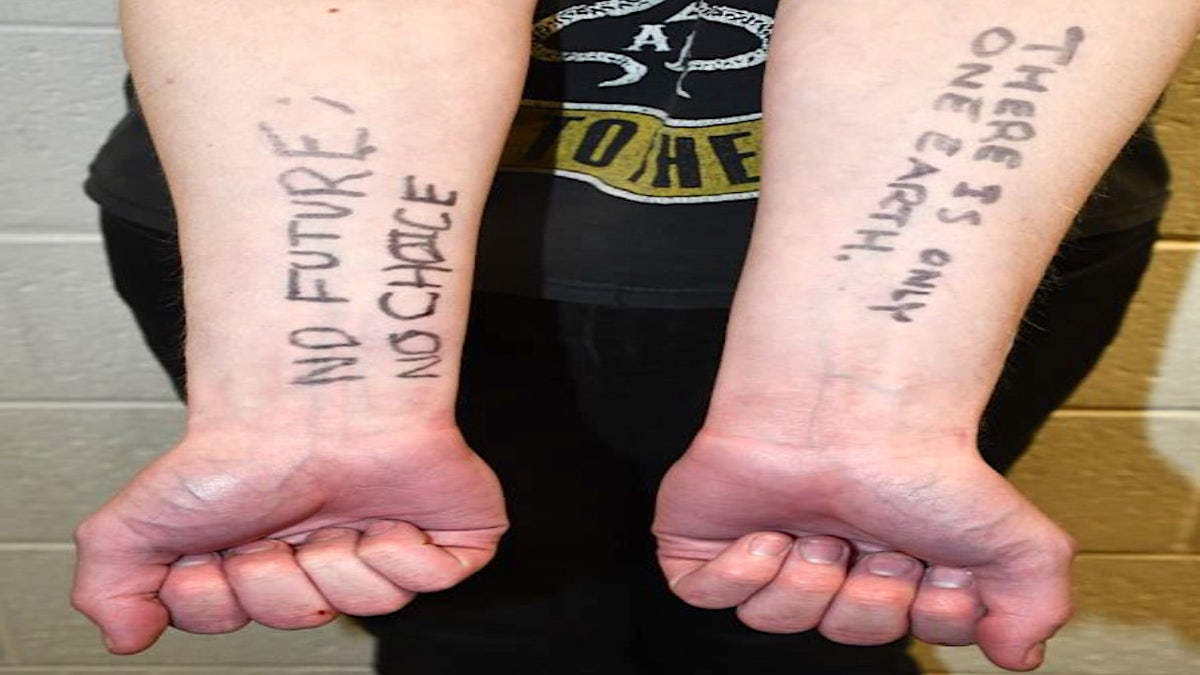 writing on Ryan Michael English's arms