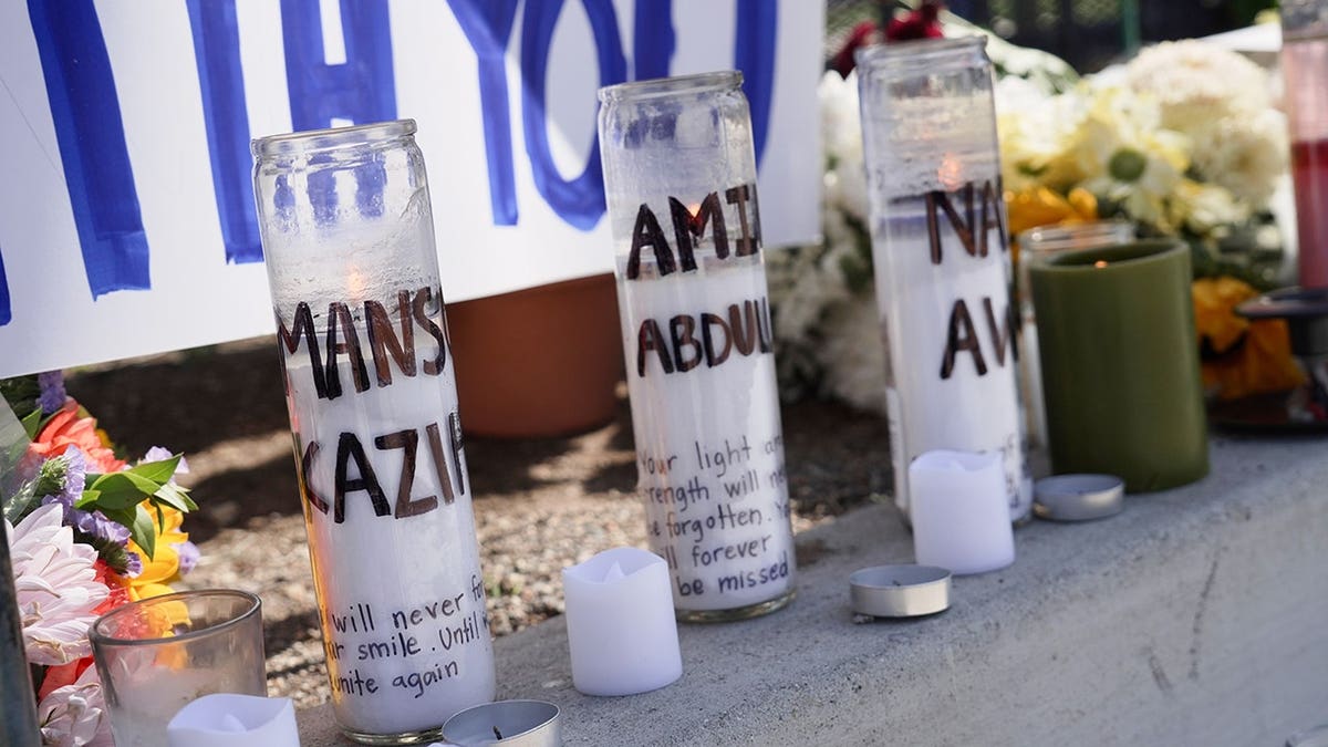 Candles with victims' names are placed outside the Islamic Center of San Diego.