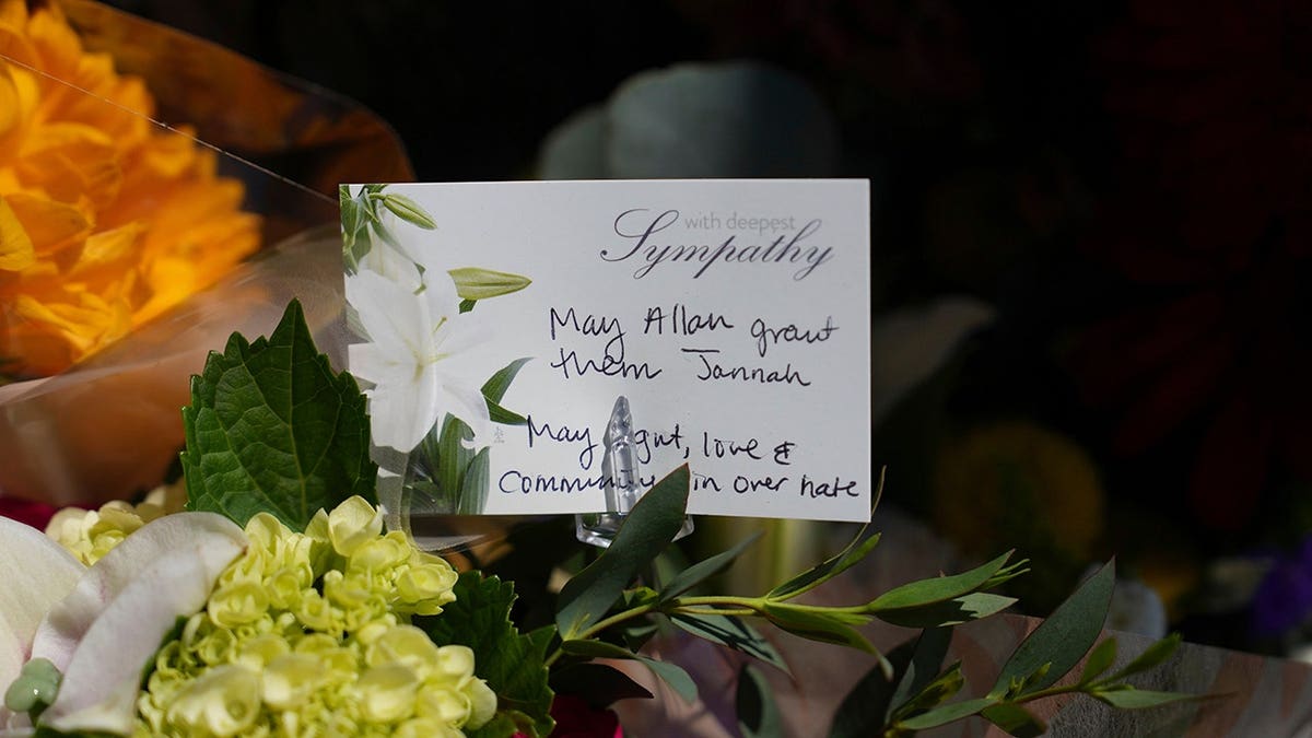 A note attached to flowers sits outside the Islamic Center of San Diego.