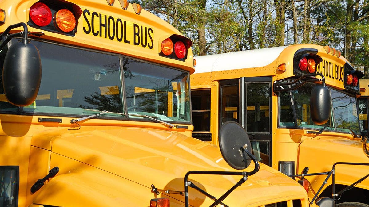 School bus drivers gathered outside.