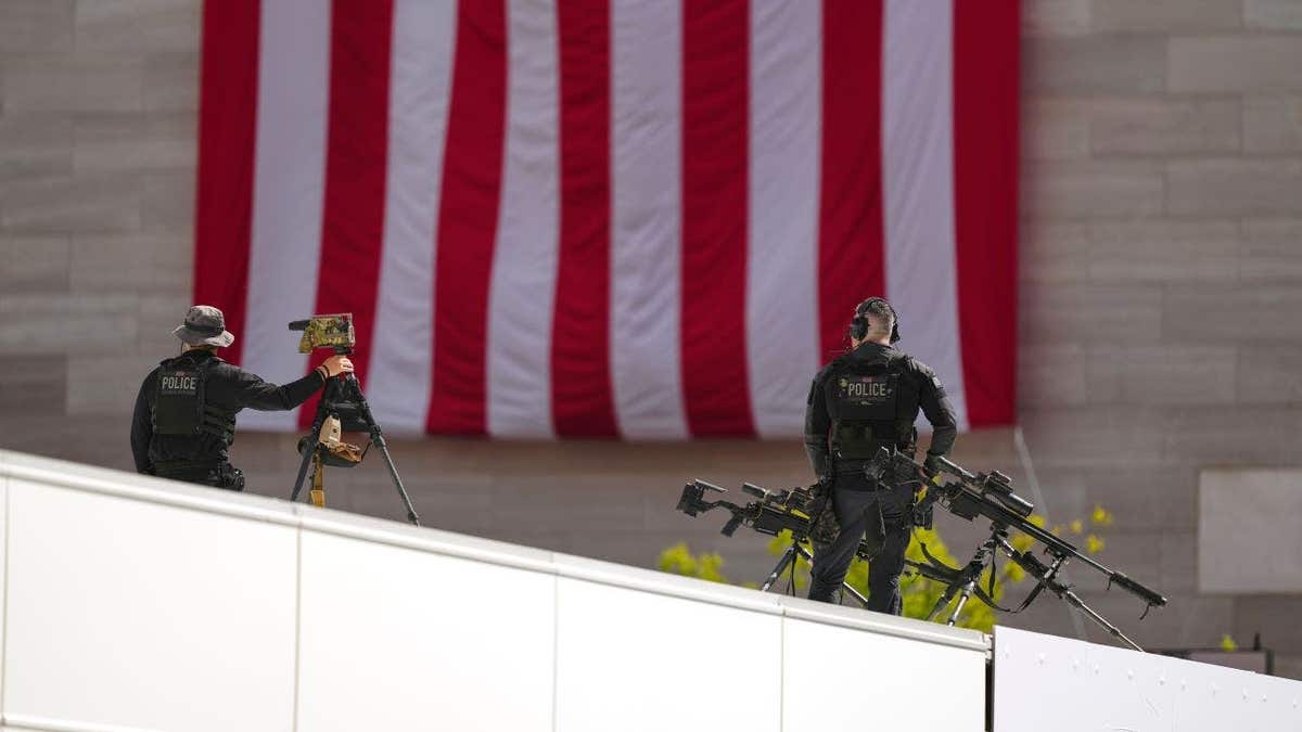Secret Service agents on a rooftop