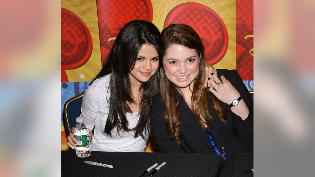 Selena Gomez and Jennifer Stone stand at the World of Disney in New York City.
