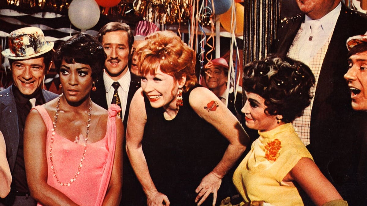Shirley MacLaine stands in a scene from Sweet Charity.