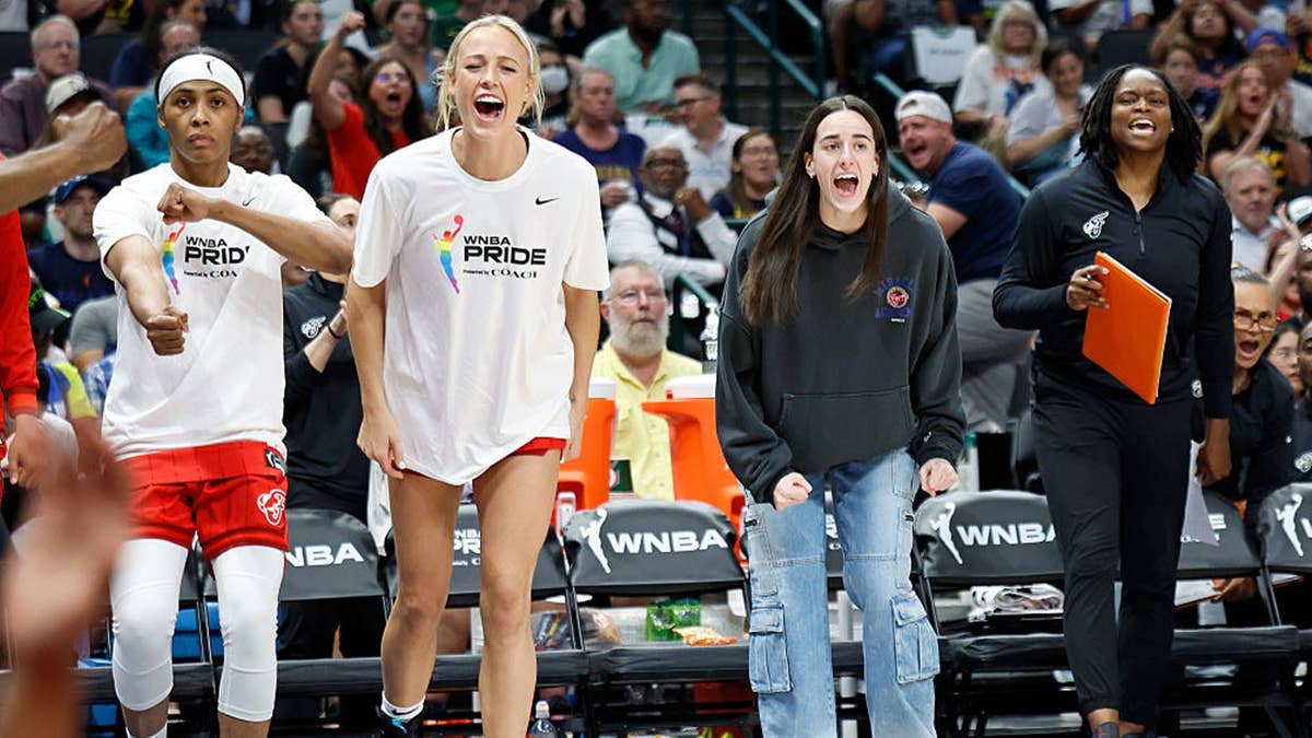 Sydney Colson #51, Sophie Cunningham #8, and Caitlin Clark #22 of the Indiana Fever