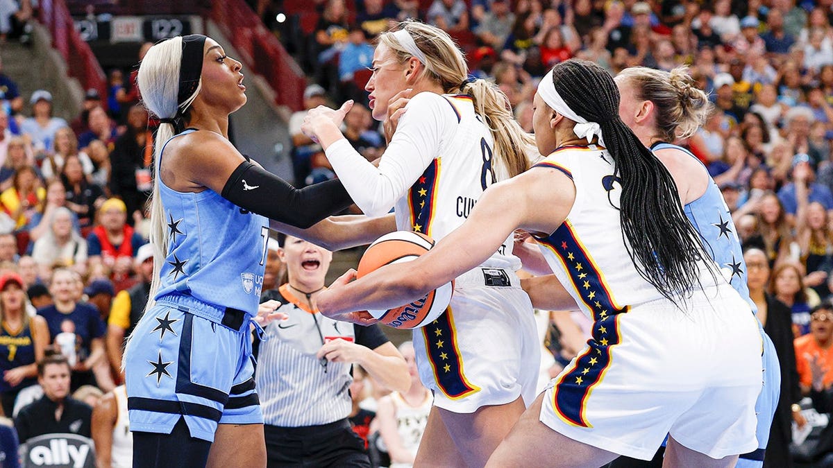 Sophie Cunningham and DiJonai Carrington fight during a WNBA game at United Center.
