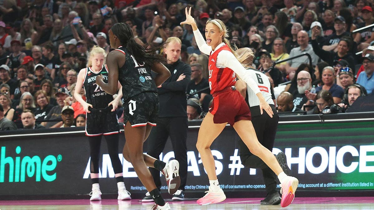 Sophie Cunningham reacts after making a three-point basket during an Indiana Fever game.