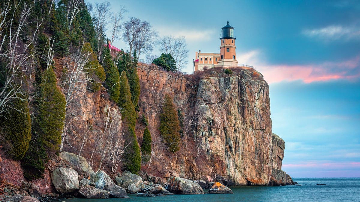 Split Rock Lighthouse stands on a rocky shoreline in Minnesota.