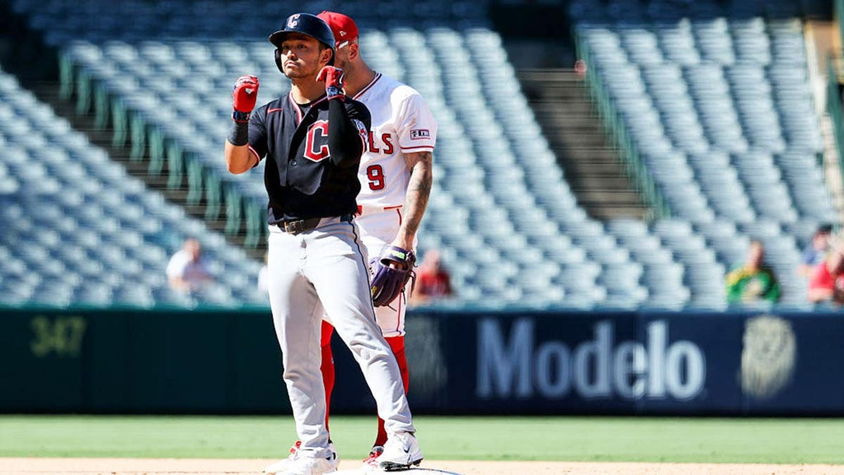 Steven Kwan doubles during a game at Angel Stadium of Anaheim.