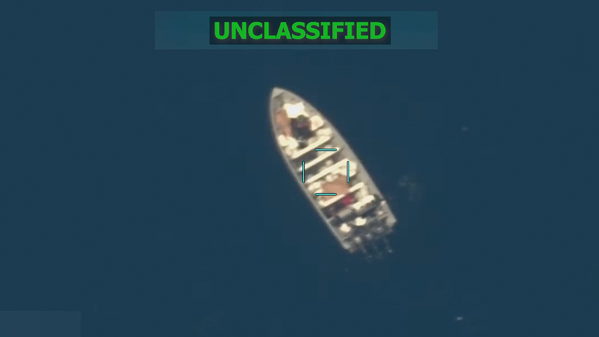 Unclassified aerial image shows a small boat with several people aboard on the water on Oct. 29, 2025