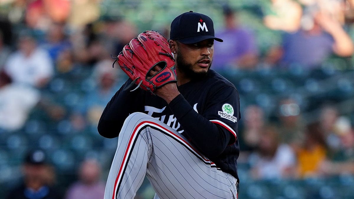 Taj Bradley throws a pitch during the first inning against the Athletics.