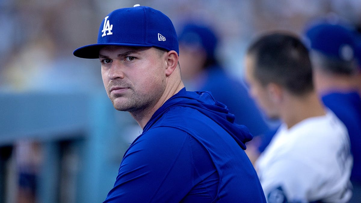 Tarik Skubal sits on the bench during an MLB game at Dodger Stadium.