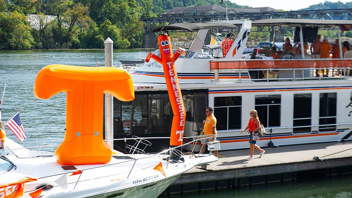 Tennessee tube man and inflatable power T on a yacht at Volunteer Landing.
