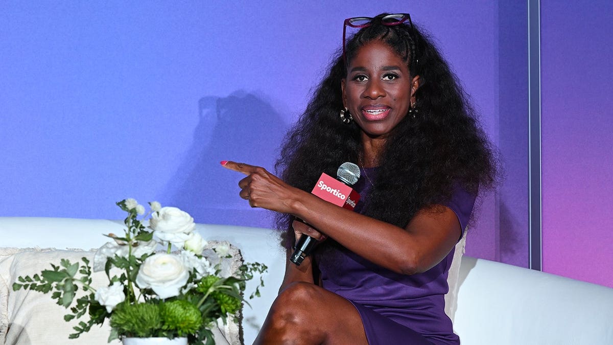 Terri Carmichael Jackson speaks on stage at Sportico RISE: Women's Sports event.
