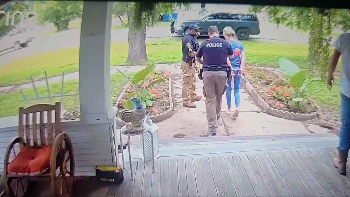 A woman being arrested