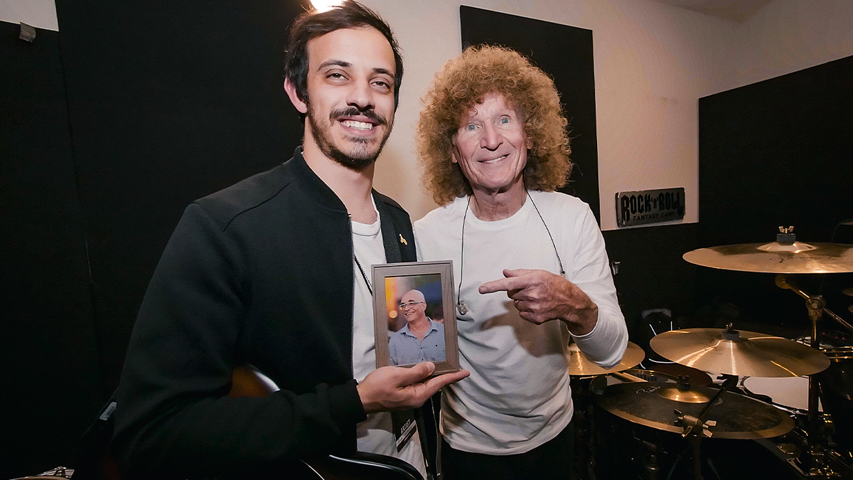 Oct. 7 survivor Bar Rudaeff stands with drummer Tommy Aldridge.