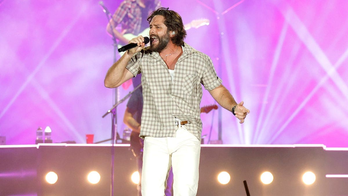 Thomas Rhett performs on stage at GEODIS Park.