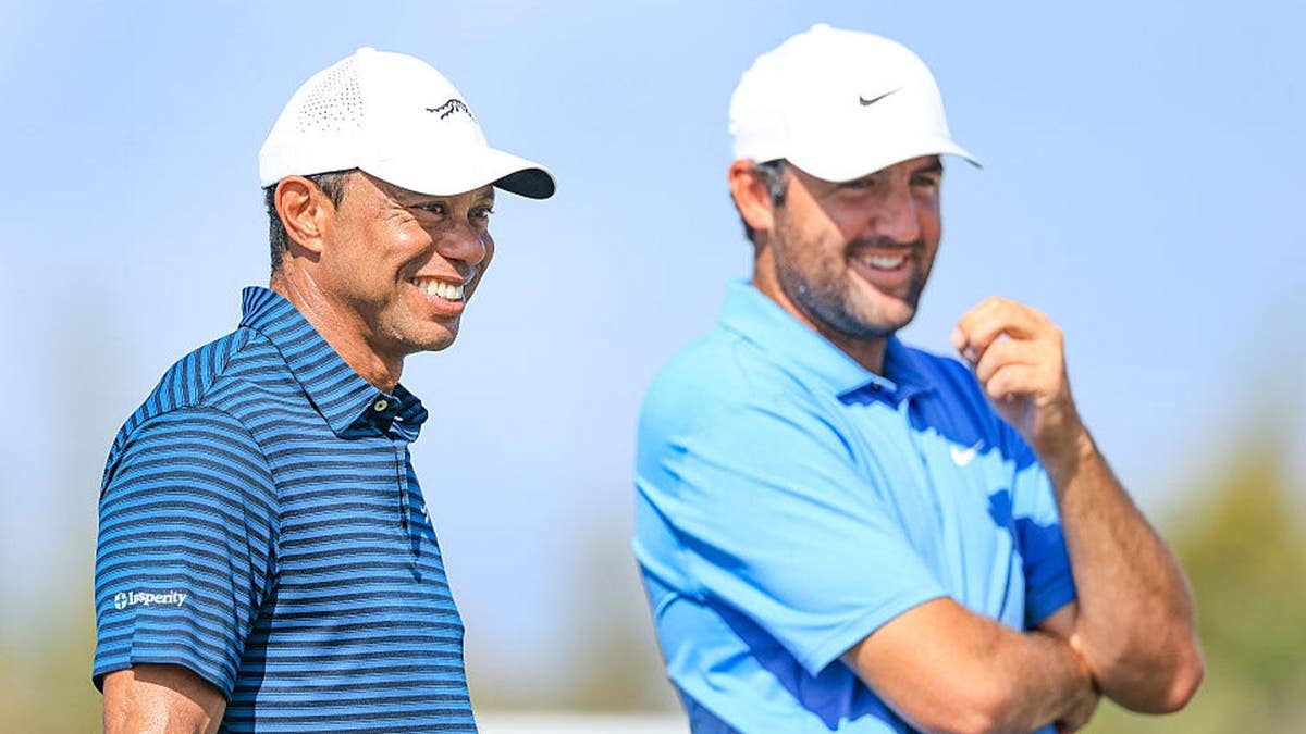 Tiger Woods of The United States out on the course watching Scottie Scheffler